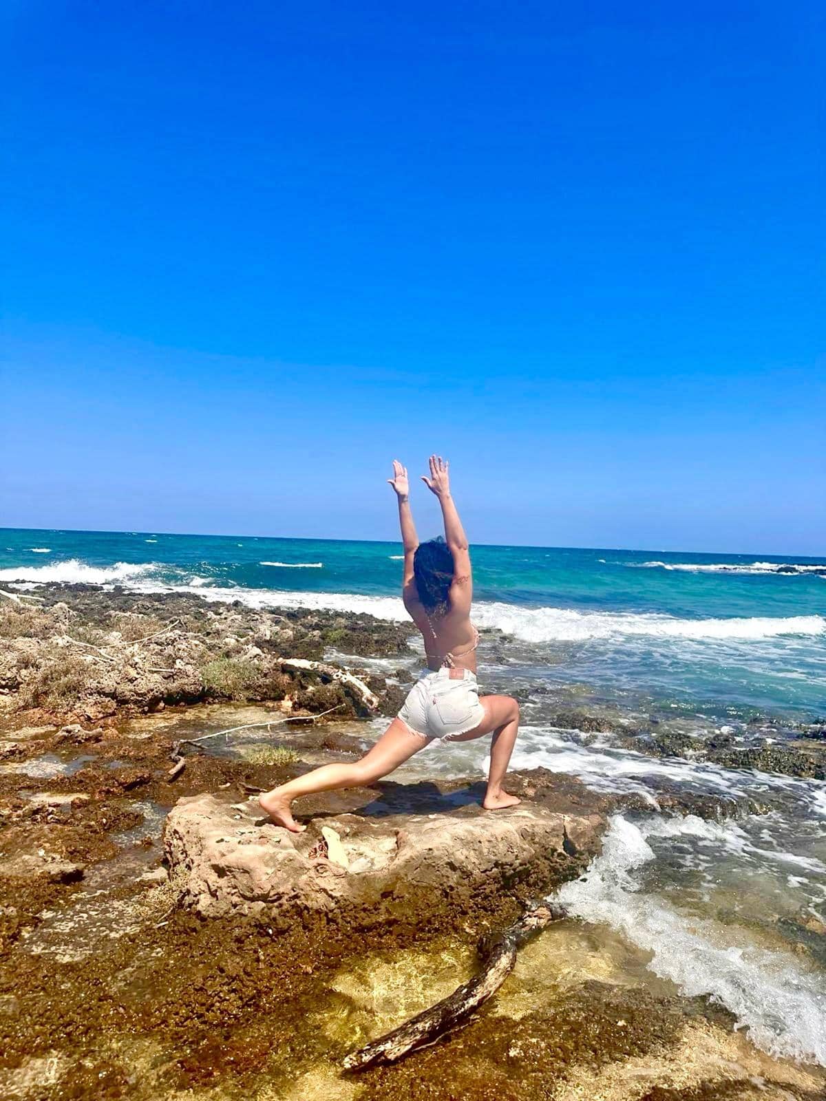 Yoga warrior pose on the Puglia coast